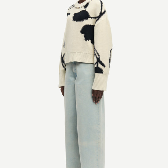 round neck cream cotton jumper with black floral print and ribbed hem, cuffs and neck from samsoe side view