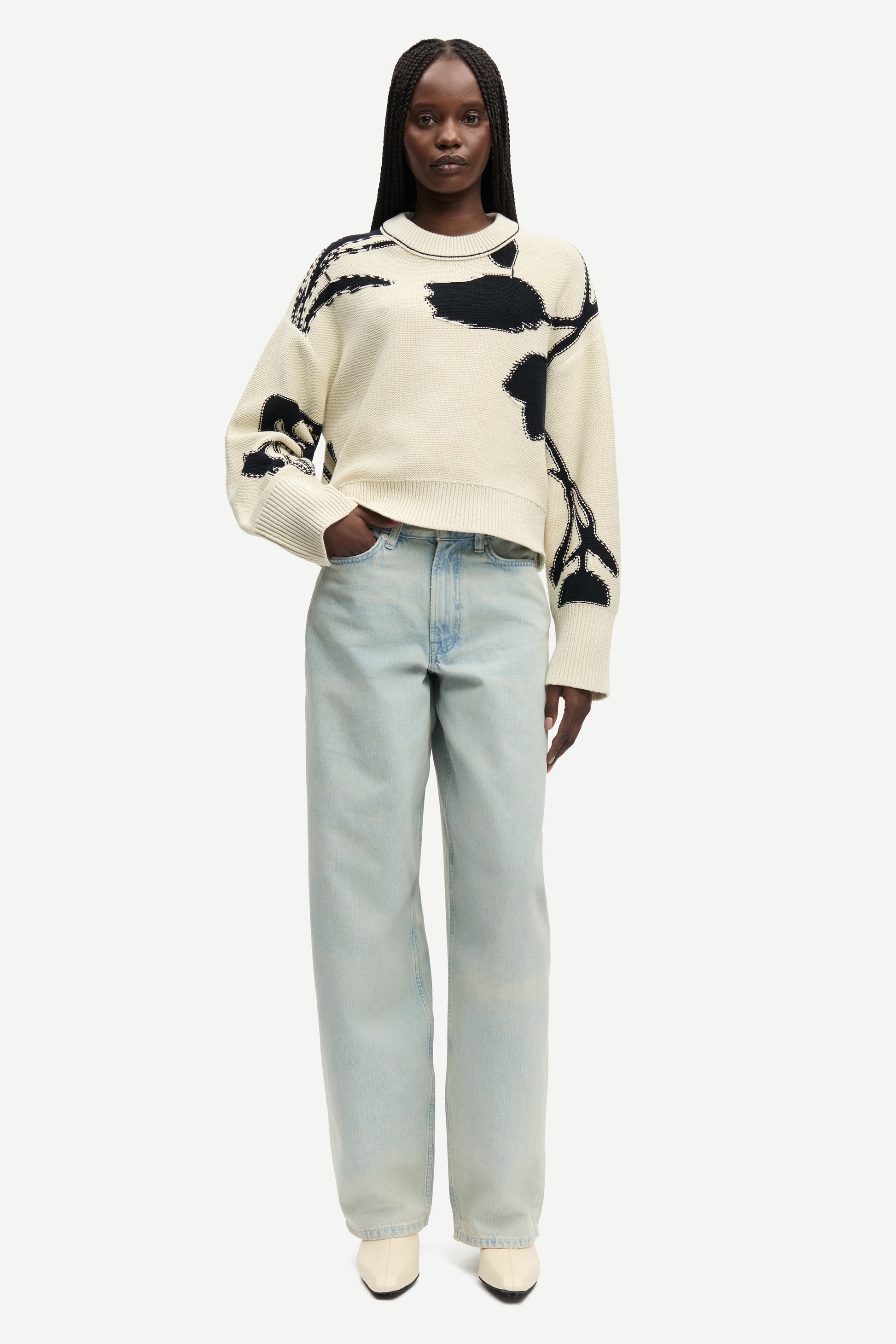 round neck cream cotton jumper with black floral print and ribbed hem, cuffs and neck from samsoe model shot