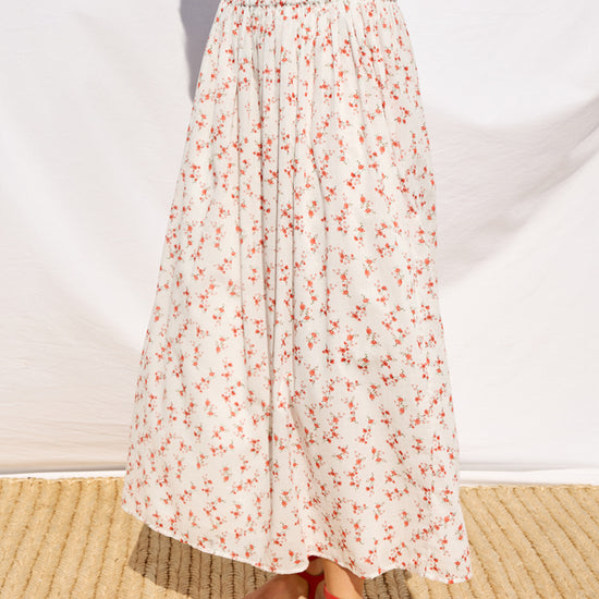 mid length white skirt with small red flowers with elasticated waist from rails model