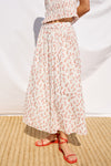 mid length white skirt with small red flowers with elasticated waist from rails model