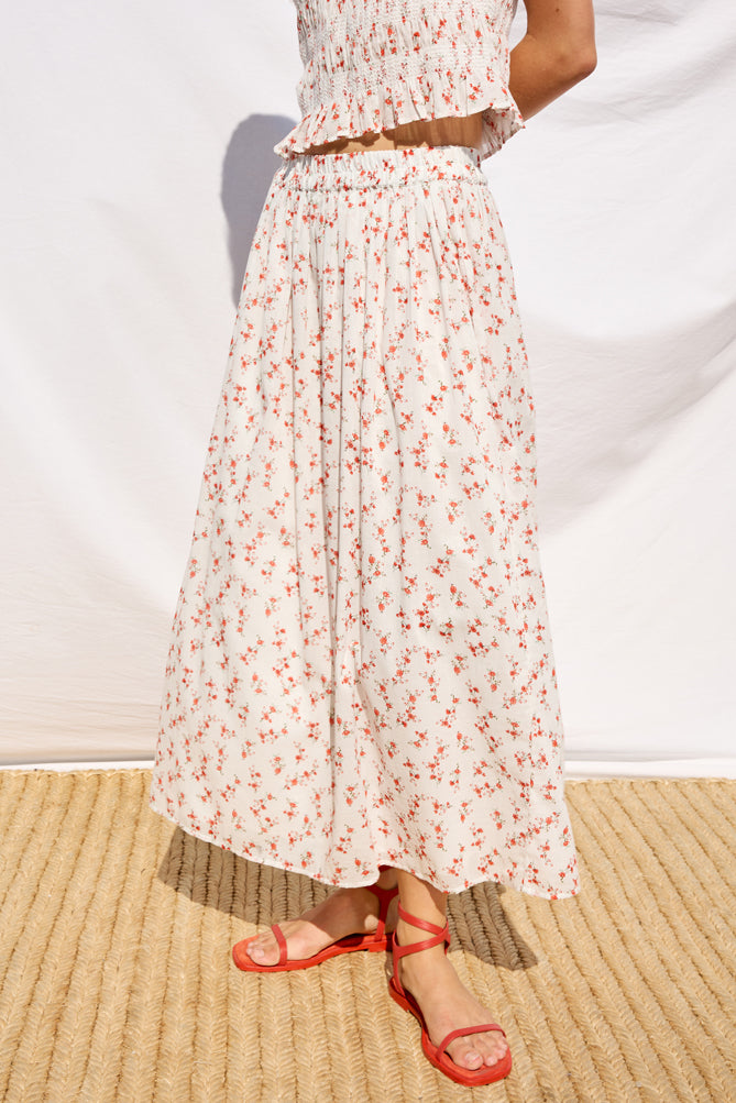 mid length white skirt with small red flowers with elasticated waist from rails model