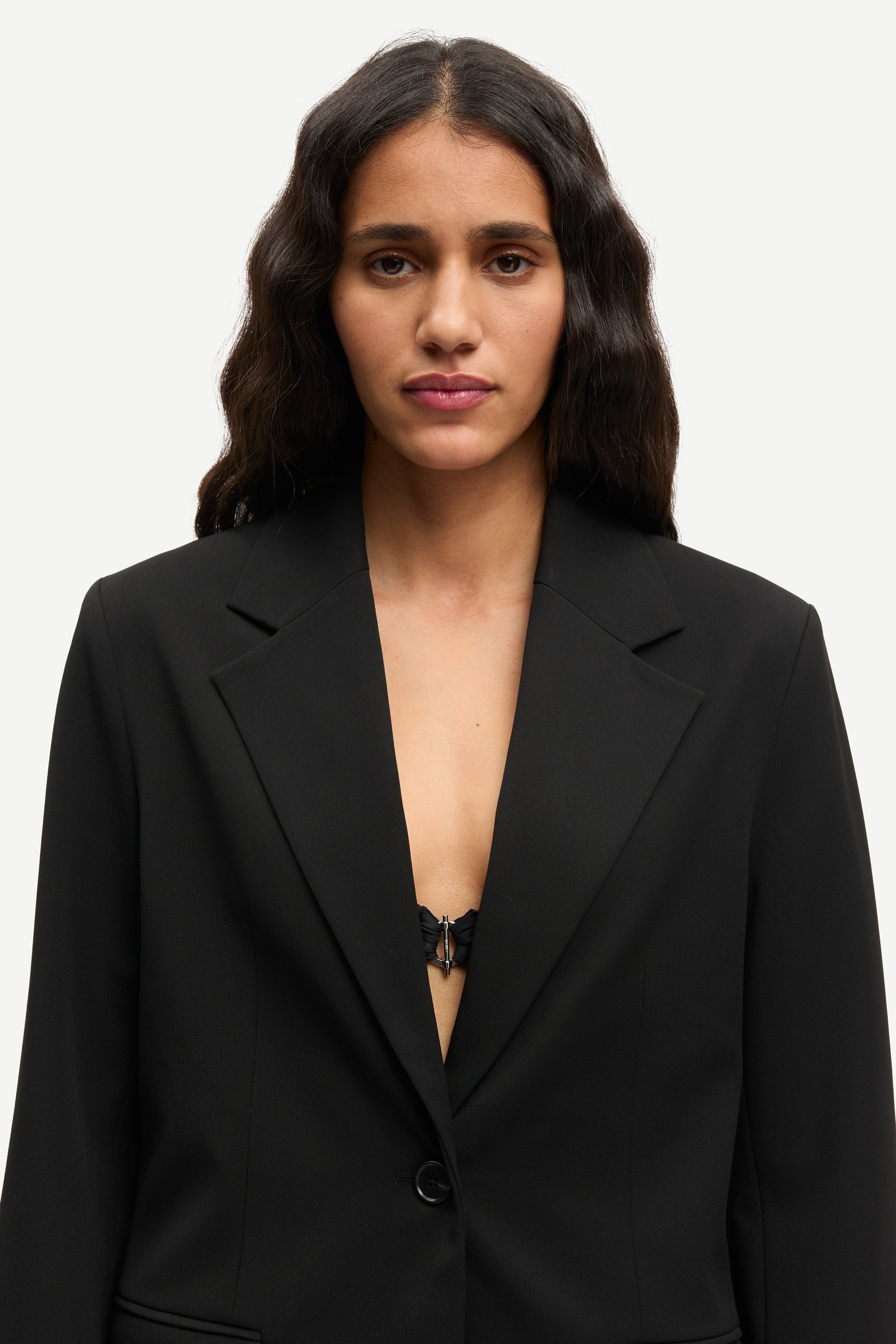 notch lapel black blazer with flap pockets and single button from samsoe close up