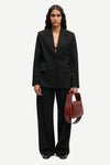 notch lapel black blazer with flap pockets and single button from samsoe model shot