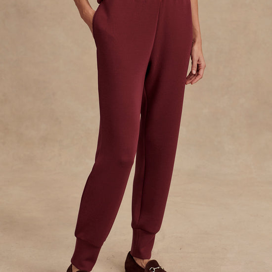 Slim fit maroon coloured sweat pants with ankle cuff and elasticated waistband