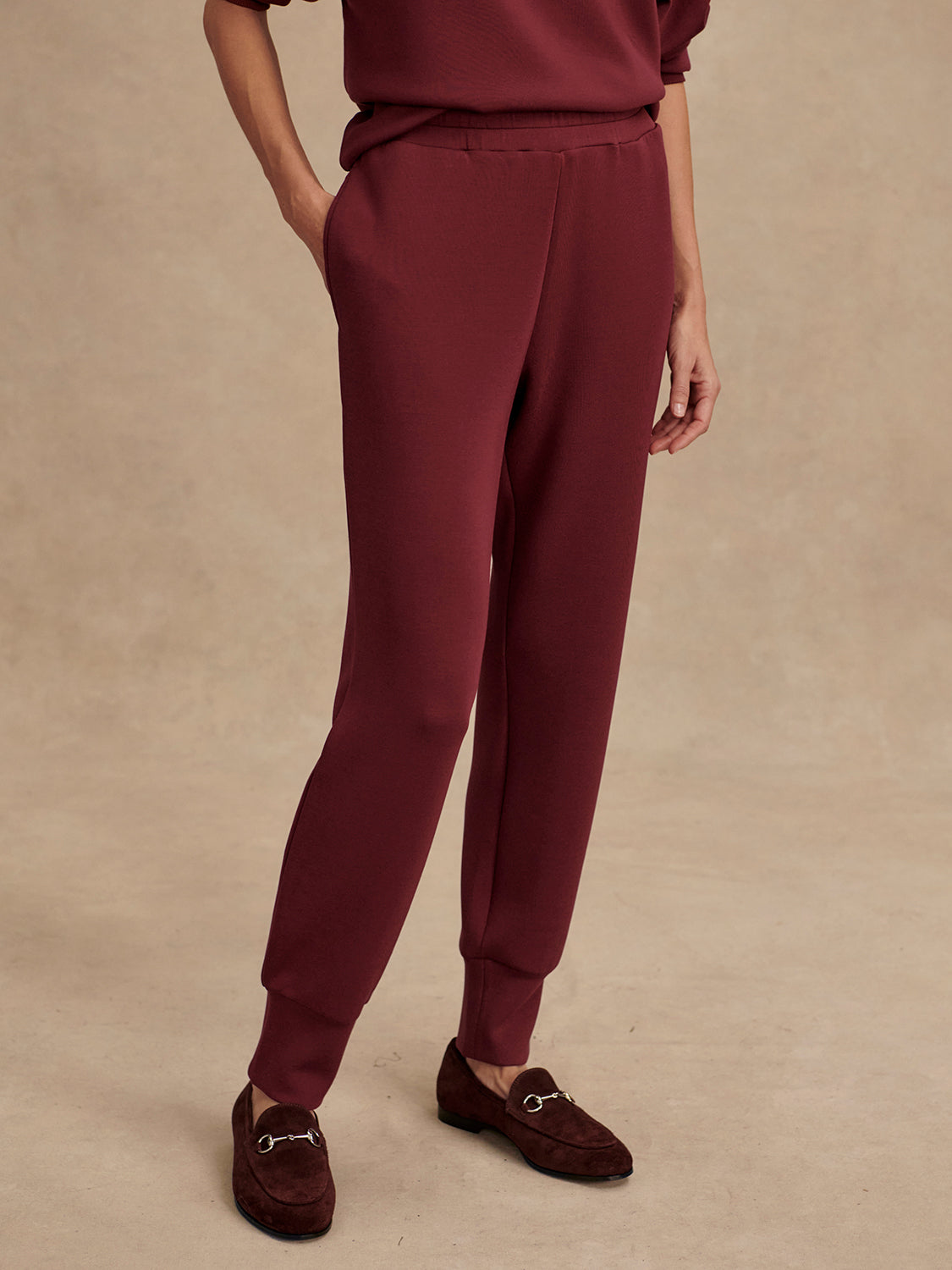 Slim fit maroon coloured sweat pants with ankle cuff and elasticated waistband