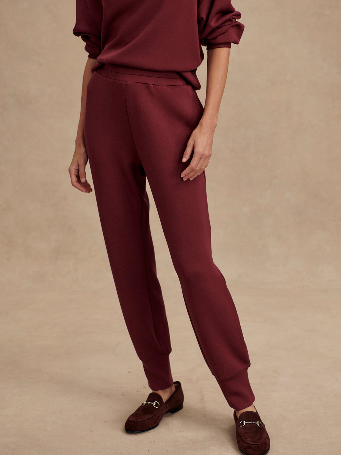 Slim fit maroon coloured sweat pants with ankle cuff and elasticated waistband