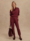 Slim fit maroon coloured sweat pants with ankle cuff and elasticated waistband model shot