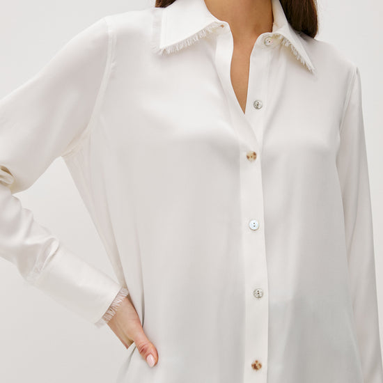 ivory silk shirt with mop buttons and classic collar with fringe detailing model shot