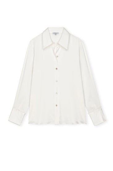 ivory silk shirt with mop buttons and classic collar with fringe detailing
