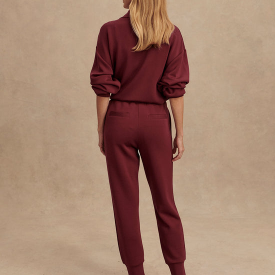 Slim fit maroon coloured sweat pants with ankle cuff and elasticated waistband rear view