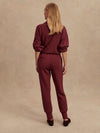 Slim fit maroon coloured sweat pants with ankle cuff and elasticated waistband rear view