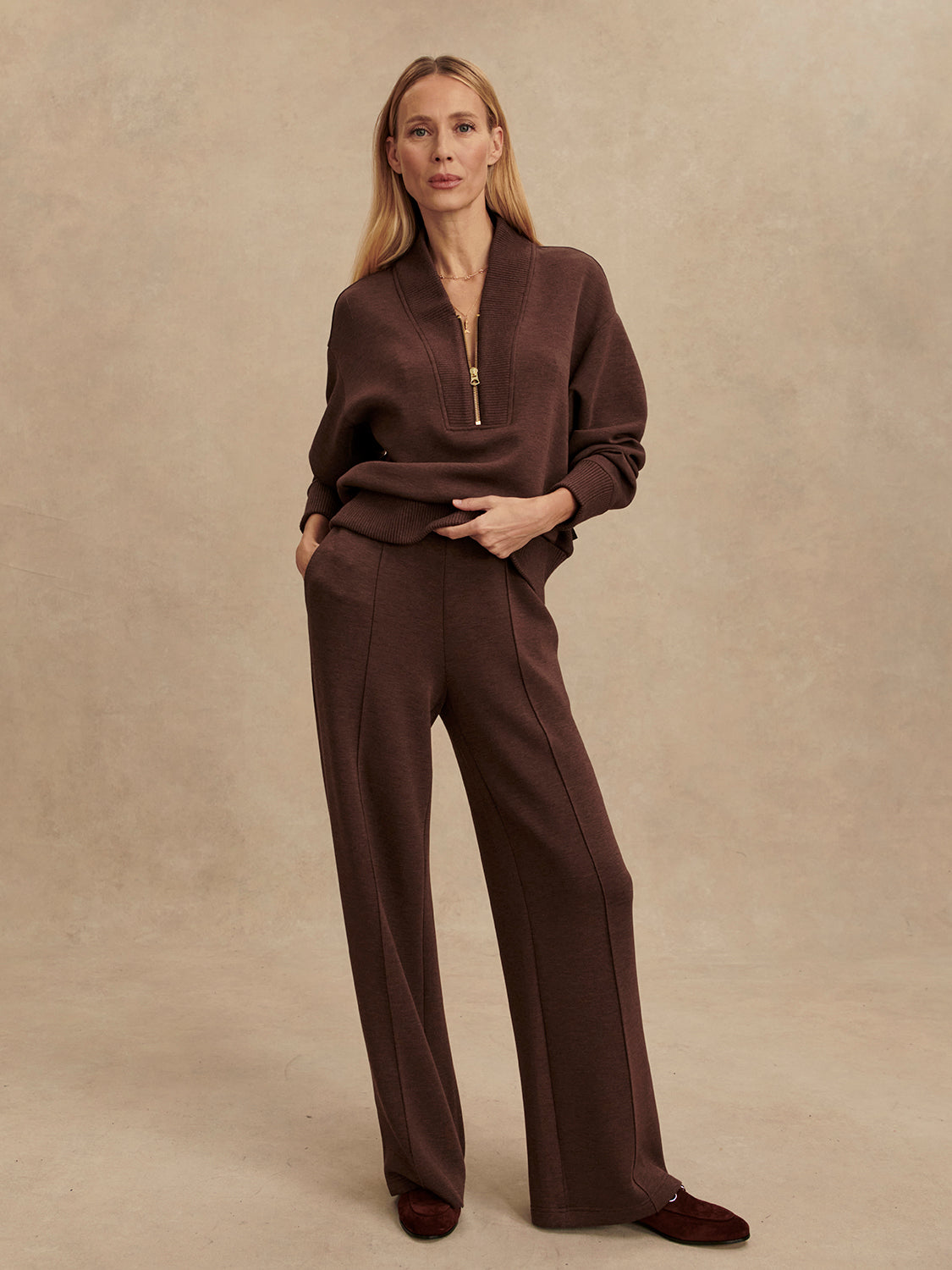 dark brown marl wide leg sweat pants with central seam down the legs and elasticated waistband with side pockets  model shot
