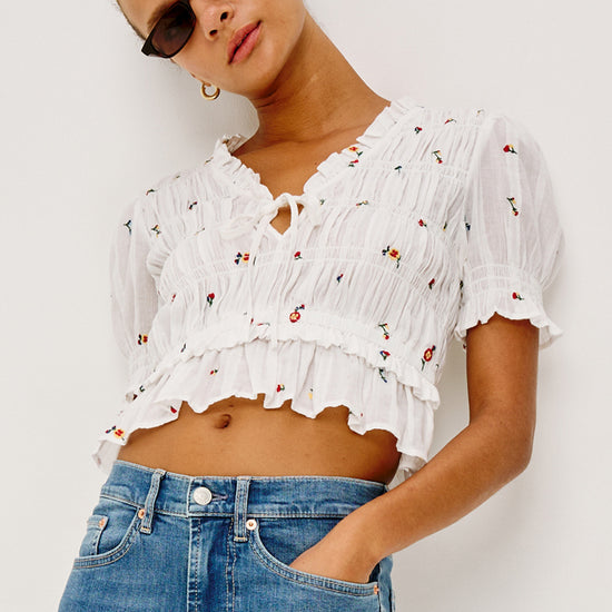 V neck short sleeve ruffle sleeve white top with tie at front and embroidered flowers from rails model