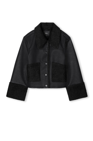 black shearling jacket with leather exterior, shearling pockets, collar and cuffs in a boxy fit 