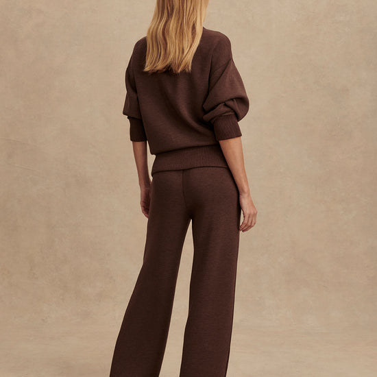 dark brown marl wide leg sweat pants with central seam down the legs and elasticated waistband with side pockets  rear view
