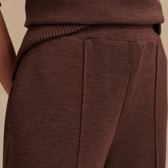 dark brown marl wide leg sweat pants with central seam down the legs and elasticated waistband with side pockets  close up