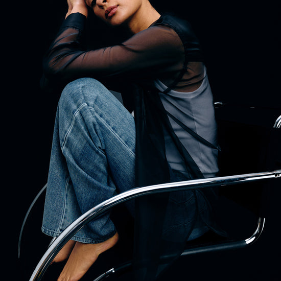 sheer polyester black shirt with chest pocket and long sleeves model shot