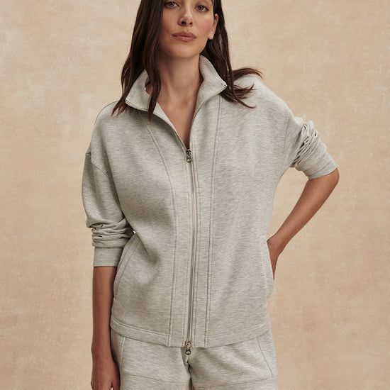 light grey marl double zip sweater with piping from varley  model shot