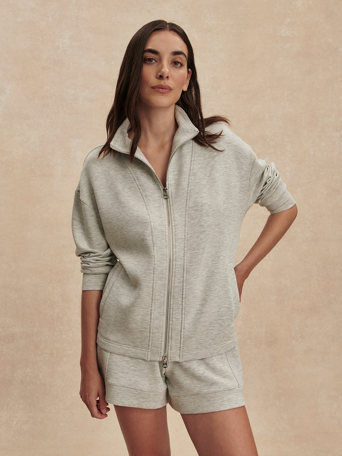 light grey marl double zip sweater with piping from varley  model shot