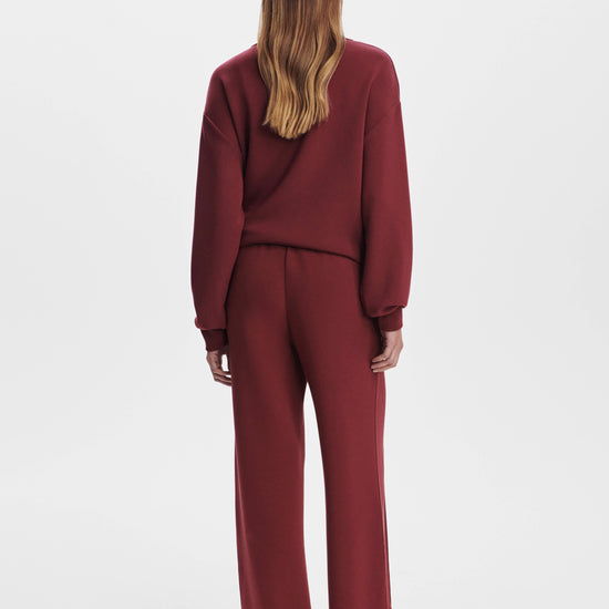 wide leg sweatpants with central front seam, elasticated waist and side pockets rear view 