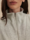 light grey marl double zip sweater with piping from varley  close up