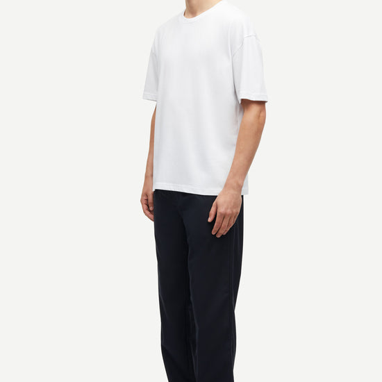 white t-shirt with crew ribbed neck, short sleeves and samsoe samsoe logo  label on side seam 