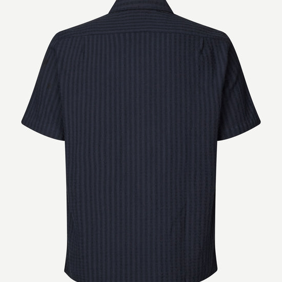 Navy self check shirt on a white background