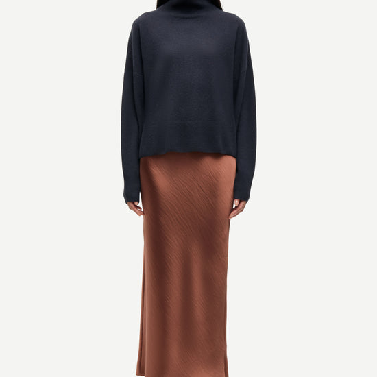 light brown long bias cut satin skirt from samsoe samsoe model shot