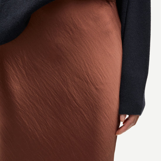 light brown long bias cut satin skirt from samsoe samsoe close up