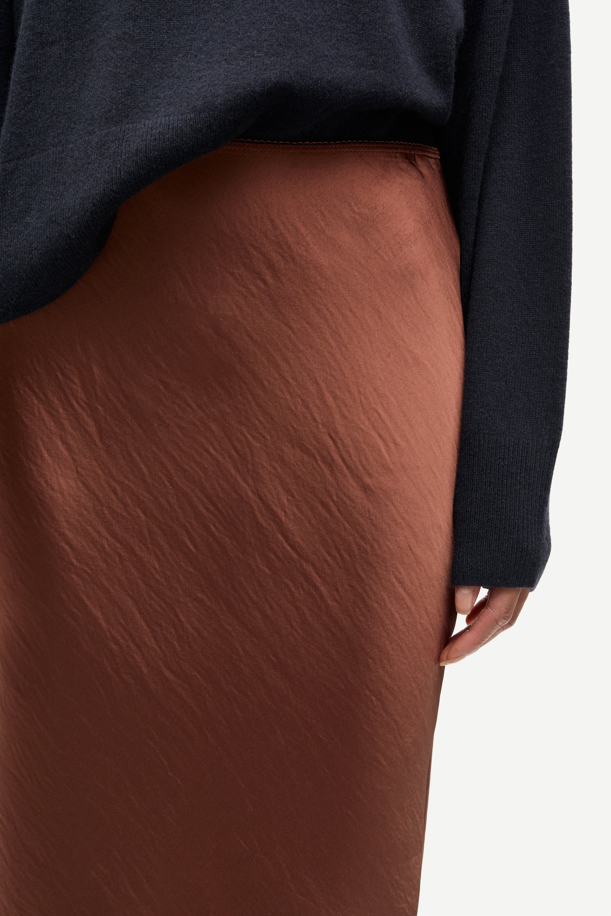 light brown long bias cut satin skirt from samsoe samsoe close up