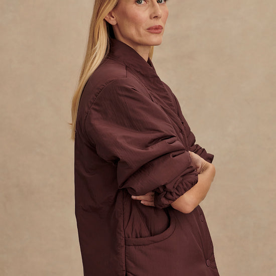 Chocolate brown padded jacket with popper buttons side view 