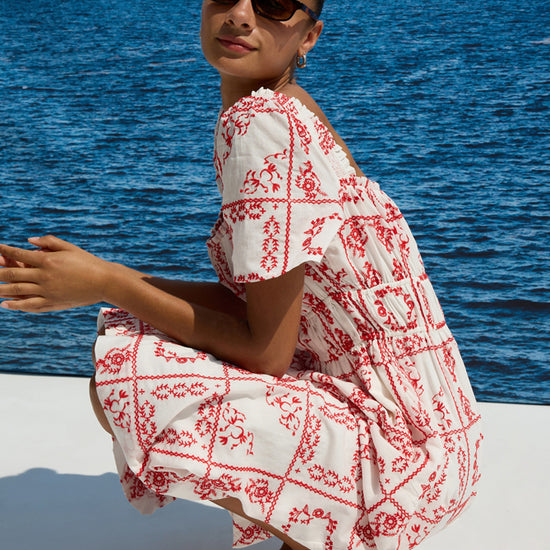 square neck white midi dress with short sleeves and red tile print from rails side view