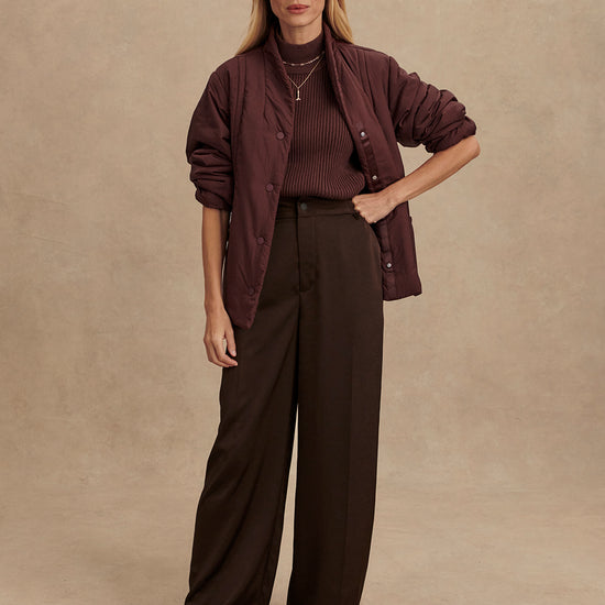 Chocolate brown padded jacket with popper buttons model shot