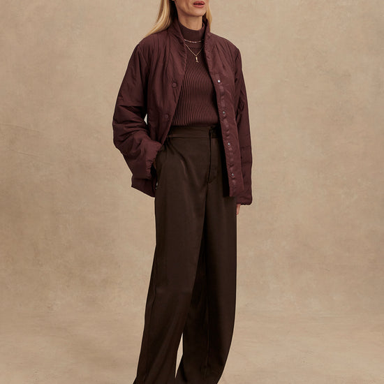 Chocolate brown padded jacket with popper buttons model shot