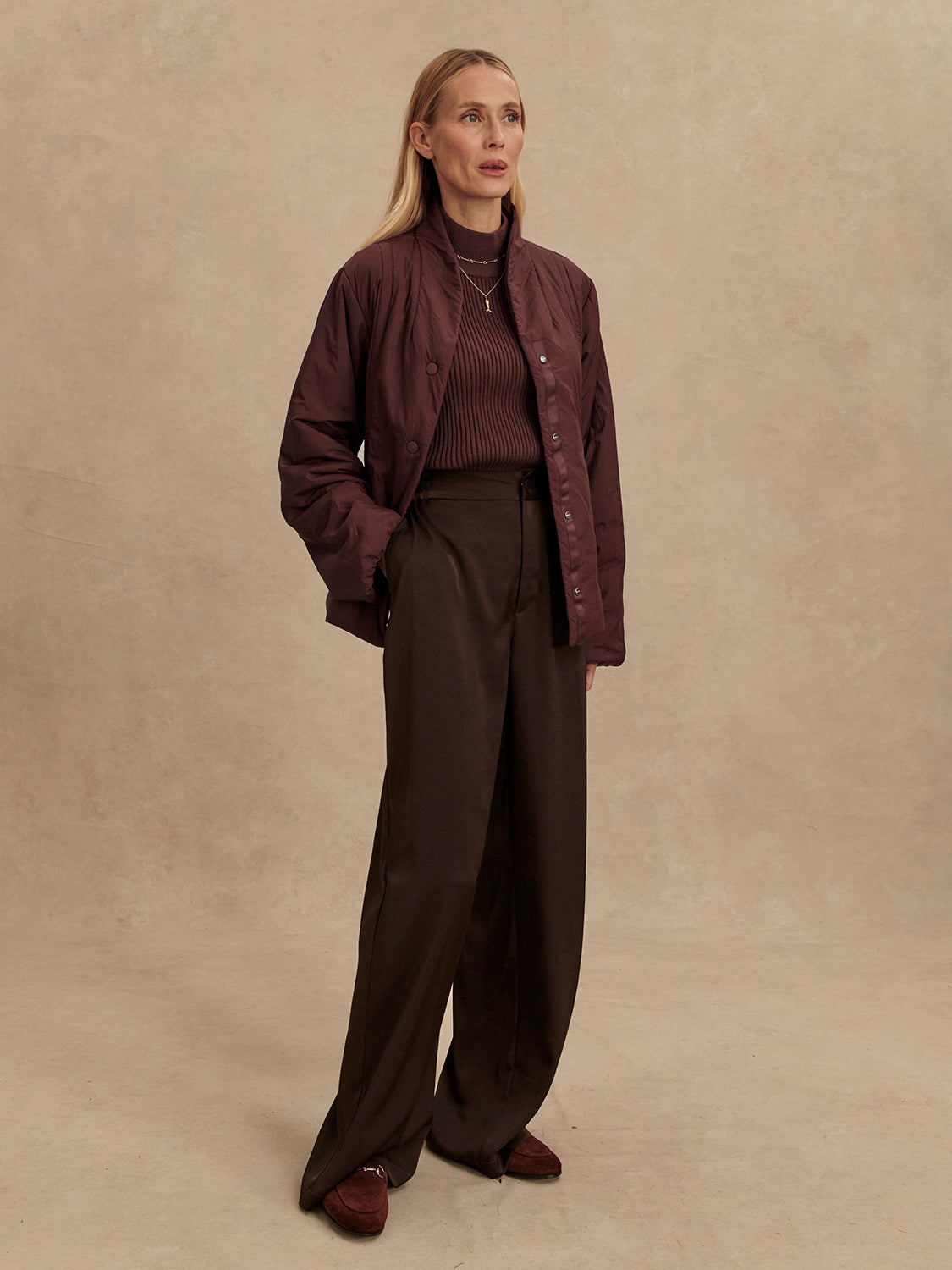 Chocolate brown padded jacket with popper buttons model shot