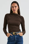 brown bodycon top with high neck, rouche detailing and long sleeves model shot