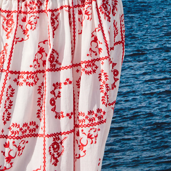 mid length white skirt with elasticated waist and red tile print from rails close up