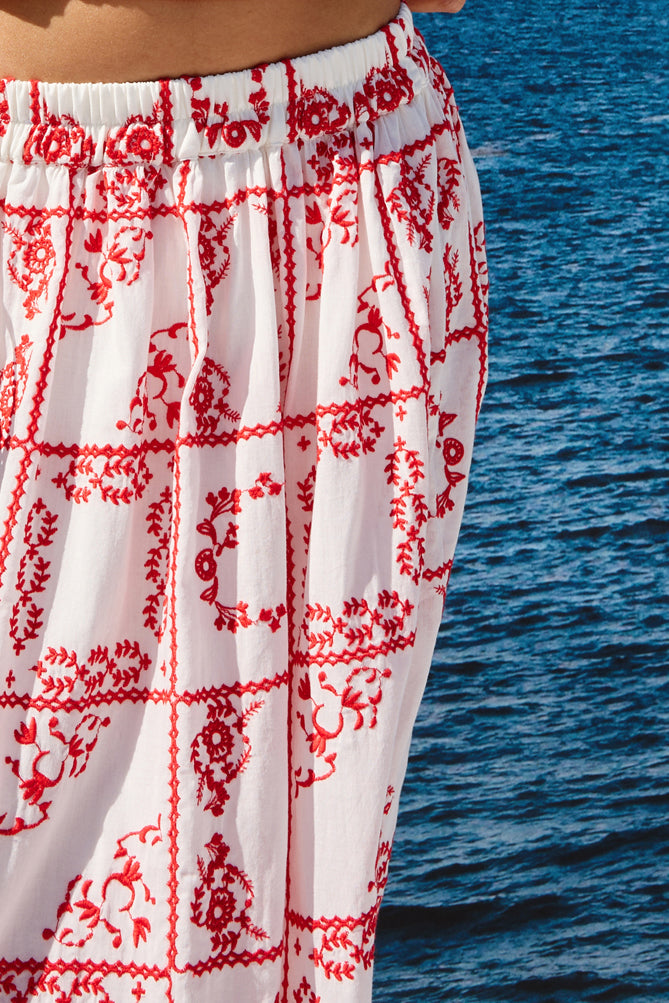 mid length white skirt with elasticated waist and red tile print from rails close up