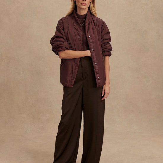 Chocolate brown padded jacket with popper buttons model shot