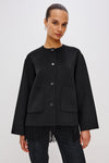 short black wool coat with patch pockets on front and fringe detailing along the hem