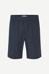 Navy blue shorts on a white background