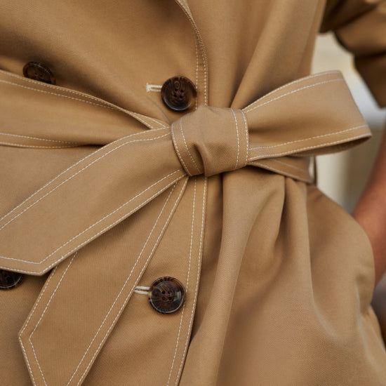 short camel trench coat with tie belt from varley close up