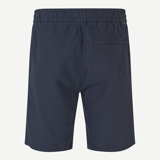 Navy blue shorts on a white background