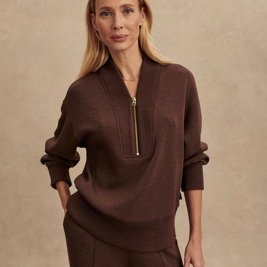 chocolate brown half zip jumper with dropped shoulder, rib detailing and gold zip model shot