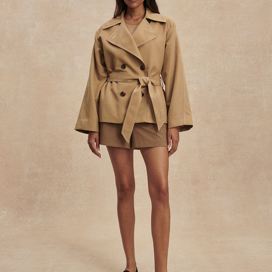 short camel trench coat with tie belt from varley model shot
