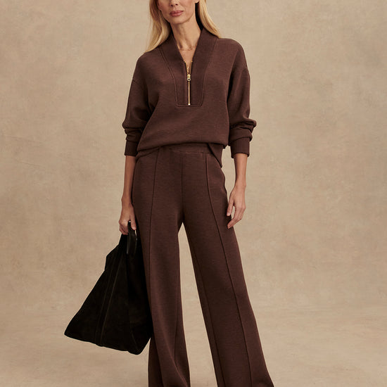 chocolate brown half zip jumper with dropped shoulder, rib detailing and gold zip model shot