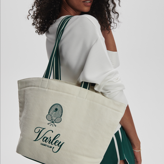 Green holdall on models shouler