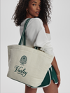 Green holdall on models shouler