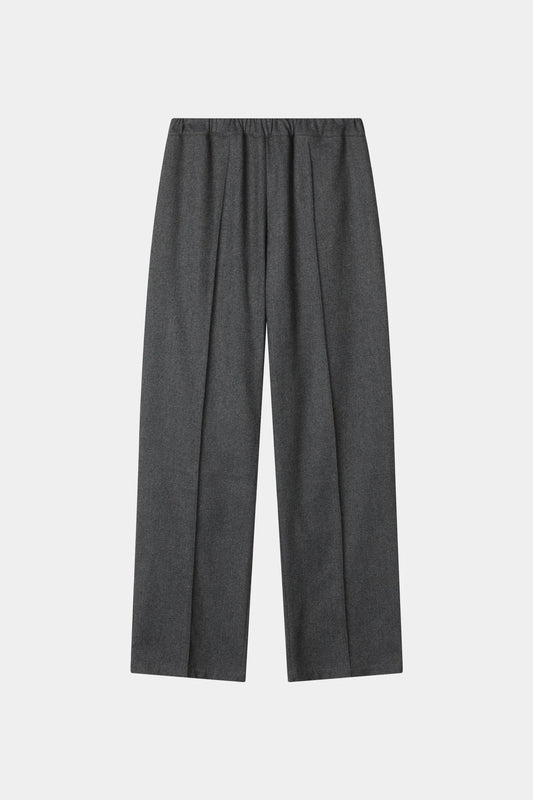 A pair of dark gray wide-leg trousers with a pleated front, displayed flat against a light gray background.