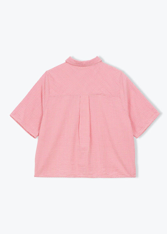 Pink checkered shirt on a white background